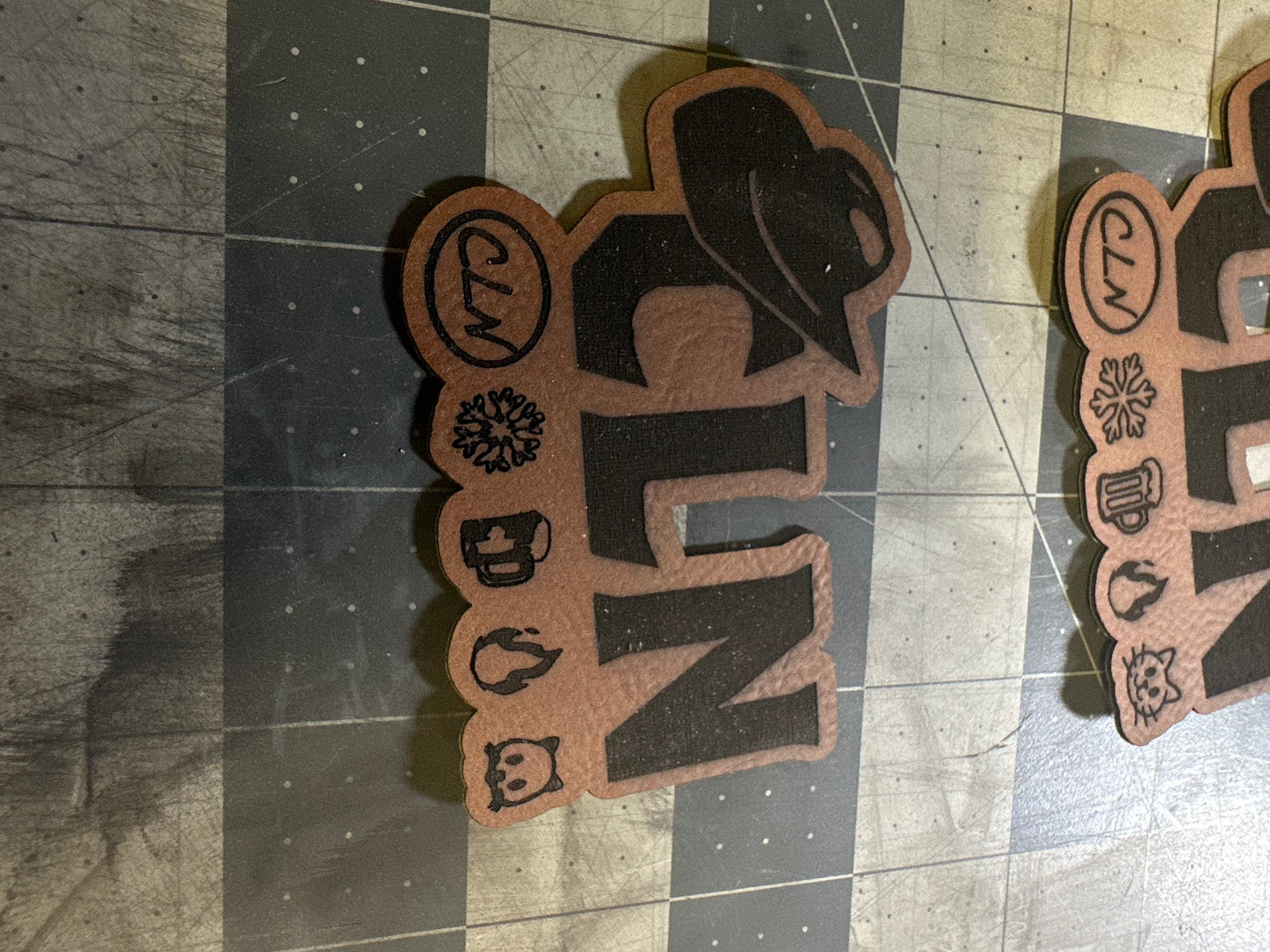 Custom laser engraved patches with custom border cut. With adhesive backing. Size up to 3.5”W x 2.5”H